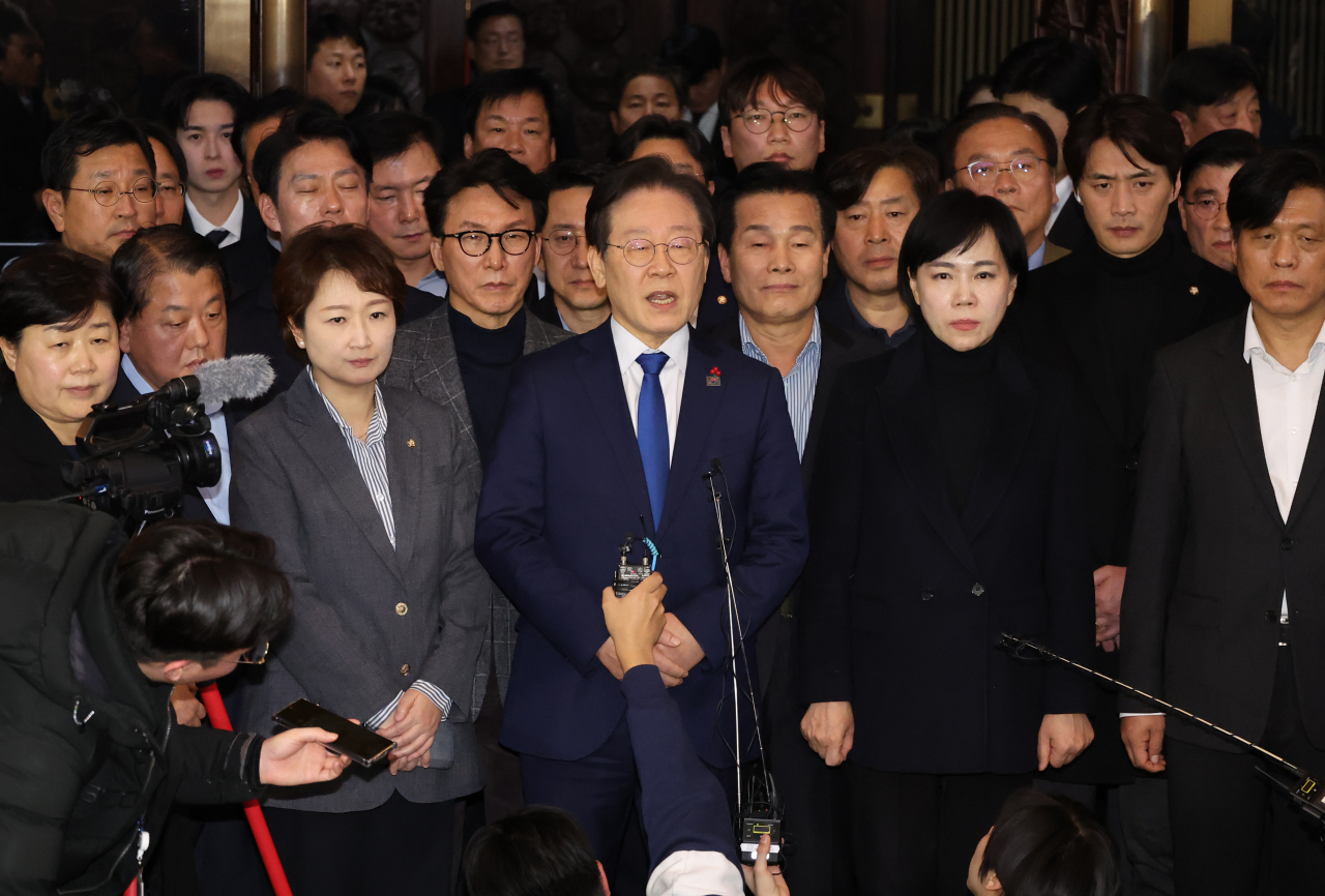 Following the passage of a resolution demanding the revocation of martial law declared by President Yoon Suk Yeol, Democratic Party leader Lee Jae-myung is expressing his position at the National Assembly in Yeouido, Yeongdeungpo-gu, Seoul, in the early hours of Dec. 4. (Yonhap)