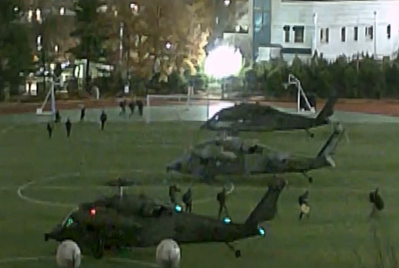 Military helicopters land inside the National Assembly grounds to enforce martial law in Seoul on Wednesday. (National Assembly)