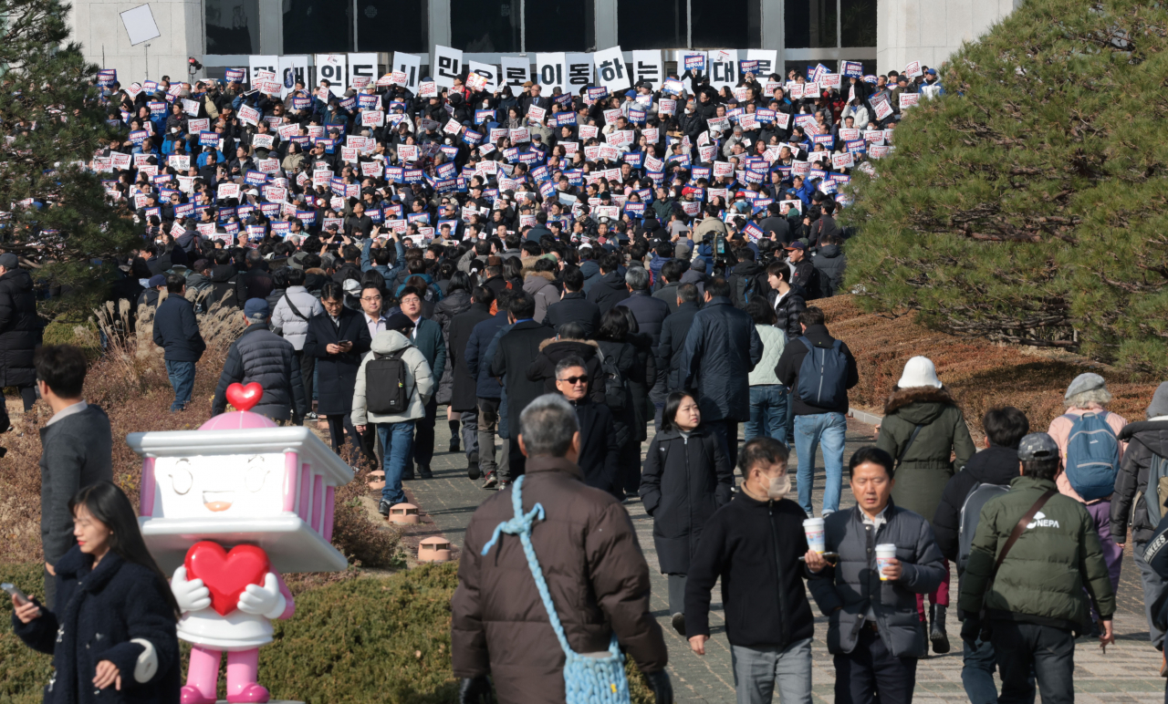 Citizens join a protest at the National Assembly in Yeuido, Seoul, hours after President Yoon Suk Yeol's martial law was lifted, Wednesday. (Yonhao)