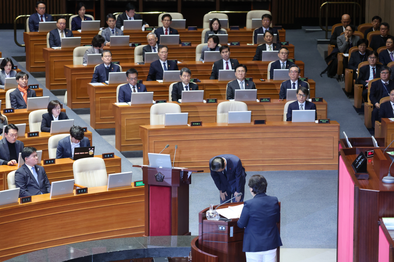 Prime Minister Han Duck-soo makes a deep bow to the public in a gesture of apology for President Yoon Suk Yeol's martial law imposition during a plenary session of the National Assembly in Seoul on Wednesday. (Yonhap)