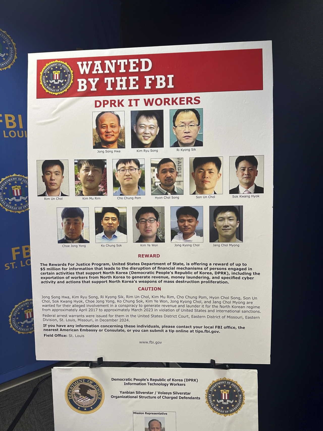 The photo shows a wanted list posted by the FBI seeking information on 14 North Koreans indicted for a scheme using fake identities to extort money from US companies. (AP-Yonhap)