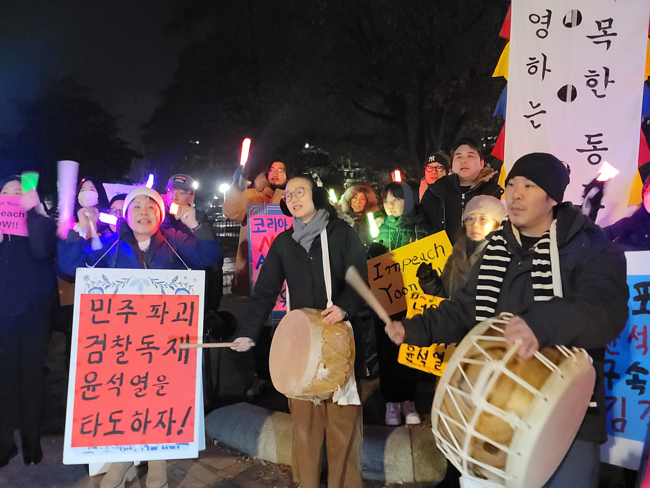 Dozens of Korean Americans stage a rally in front of the White House in Washington to call for President Yoon Suk Yeol's impeachment on Friday.(Yonhap)