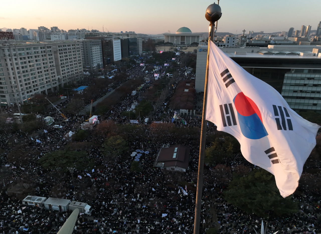 Protesters gather near the National Assembly in Yeouido, wetern Seoul, on Saturday, calling for the impeachment of President Yoon Suk Yeol. Yonhap