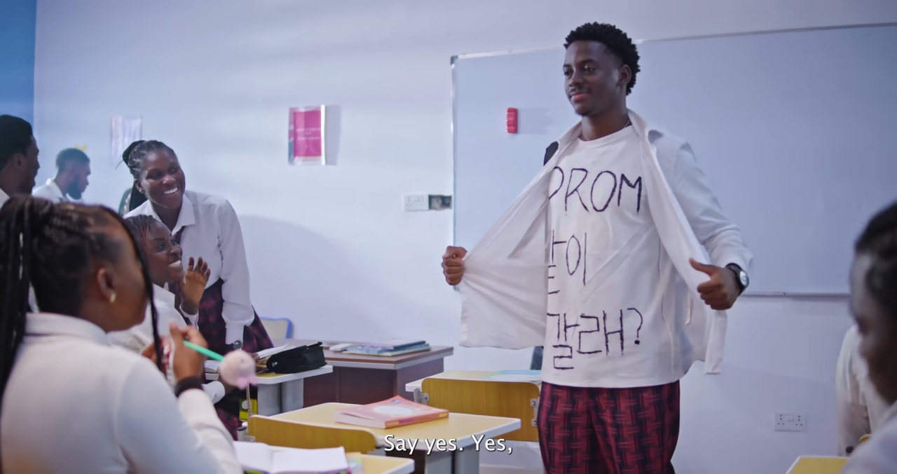 Played by Kemi Ikuseedun, Daniel, a classmate with a crush on Charis Benson, surprises everyone by asking her to prom with a dramatic reveal of his T-shirt, which reads “Will you go to prom with me?” -- catching both Charis and her crush Gerald off guard. (YouTube)