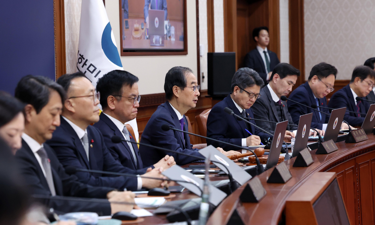 Acting President and Prime Minister Han Duck-soo, center, speaks during a Cabinet meeting held at Government Complex Seoul in Jongno-gu, central Seoul, Tuesday. This marked the first time Han presided over a regular Cabinet meeting after assuming the role of acting president, following President Yoon Suk Yeol's impeachment by the National Assembly on Saturday. (The Presidential Office Press Corps)