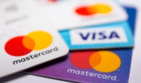 Woori, BC improve profits in overseas card business