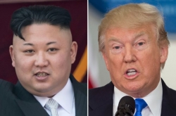 North Korea backs off missile attack as US ups pressure on China