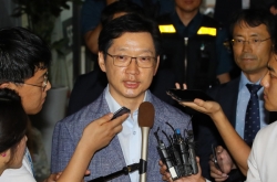 Gov. Kim heads home after overnight interrogation in opinion rigging probe