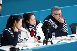 Team Kim's Canadian coach backs curlers' abuse claims