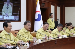 Moon asks for calm, vows air-tight quarantine