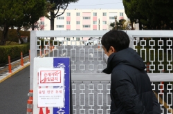 Virus-hit apartment under isolation, most cases linked to Shincheonji