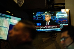 Global stocks suffer historic rout, shrugging of central bank steps