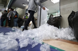 [Newsmaker] Single-use plastic gloves at polls raise eyebrows