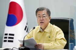 Moon says current surge ‘last hurdle,’ warns against panic