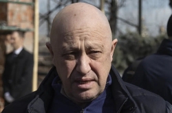 The mercenary chief who urged an uprising against Russia's generals has long ties to Putin