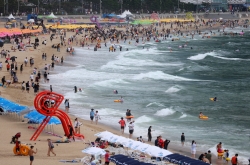 Korean workers feel the pinch, half not planning summer vacation