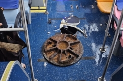 Typhoon Khanun causes manhole cover to explode, strike bus