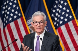 US Fed keeps key rate unchanged for 5th straight time, signals 3 rate cuts this year