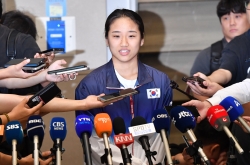 Badminton gold medalist says she's not picking fights with natl. federation