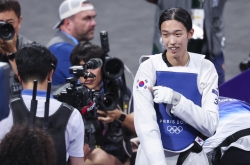 Unheralded athlete reaches top of taekwondo podium after taking detour to Paris