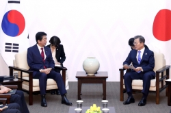 Moon, Abe confirm differences on comfort women, NK in summit