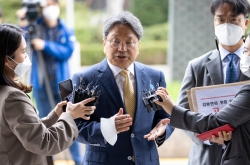 Former presidential aide files defamation suit, denies bribery accusation