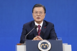 Moon rules out immediate pardons for ex-presidents, divides parties