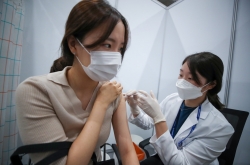 Moon says vaccinations 'faster than expected' as half of population gets first shots