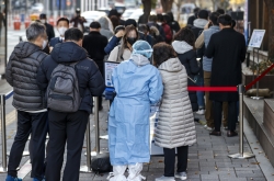 S. Korea's daily virus cases hit new record high amid relaxed virus curbs