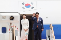 Yoon arrives in Lithuania, begins 6-day diplomatic trip