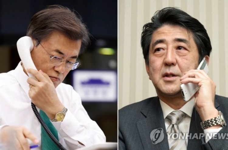 Abe wishes talks with NK during phone meeting with Moon