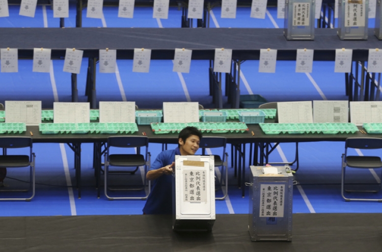 Japan's ruling coalition wins election, promises revival