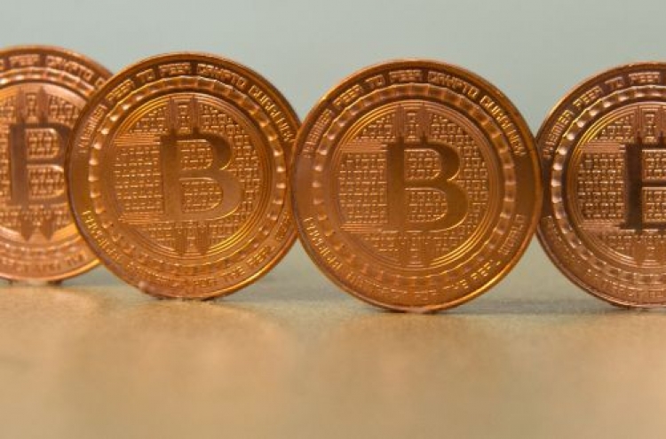 UBS boss says bitcoins 'not money', urges regulators to act