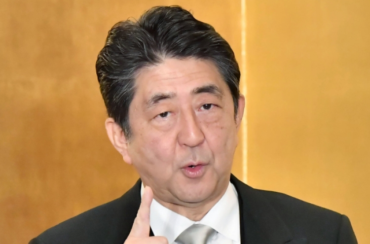 Abe rejects S. Korea's latest stance on sex slavery deal