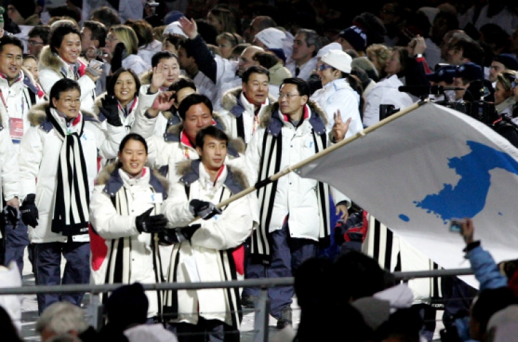 If two Koreas march together at Olympics, what flag do they raise?