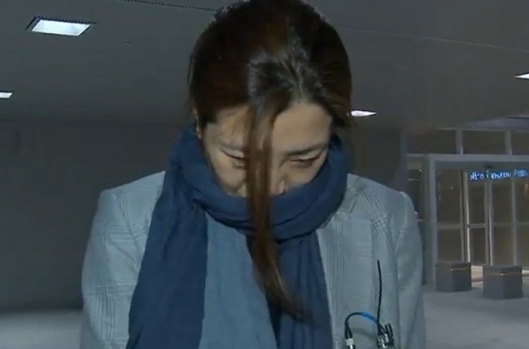 Korean Air heiress returns home to barrage of criticisms, probe for violence