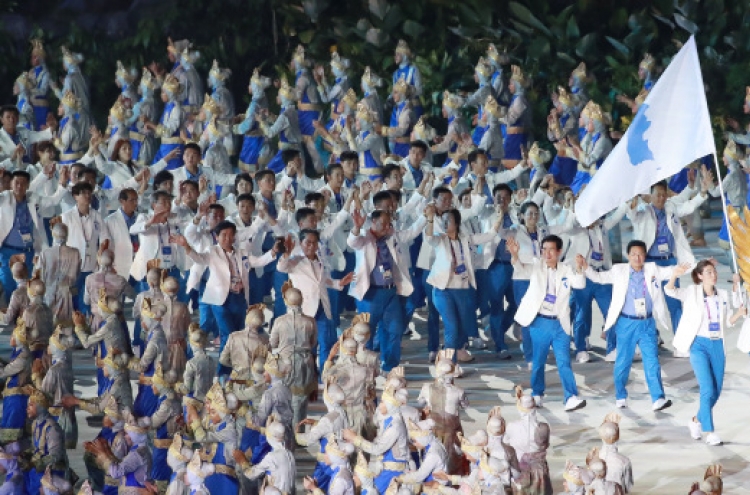 Koreas march together at Asian Games' opening ceremony