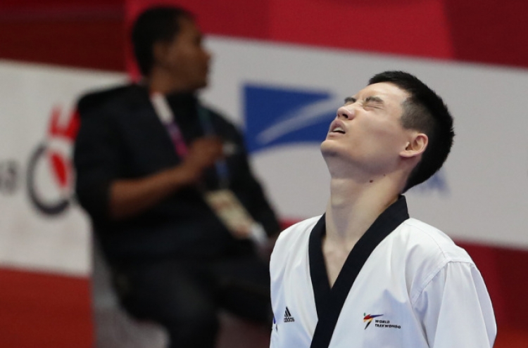 Taekwondo poomsae practitioner Kang Min-sung wins S. Korea's 1st gold