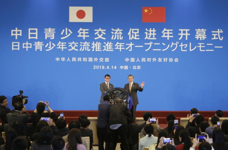 China, Japan tout 'recovered' ties amid global uncertainty
