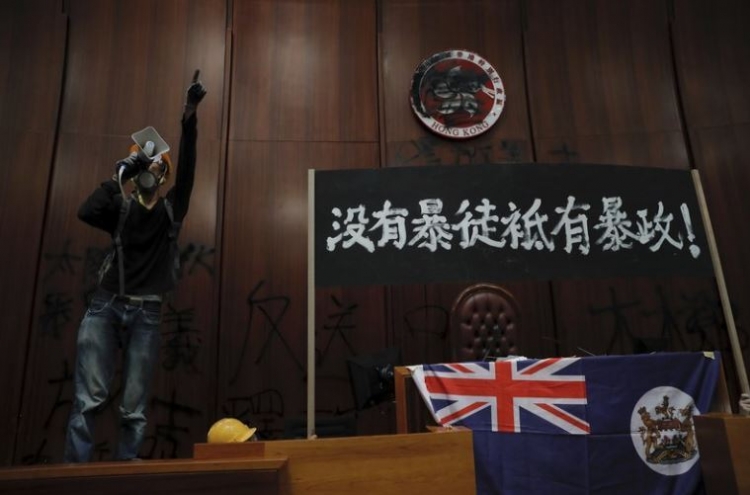 Riot police clear away protests from Hong Kong legislature