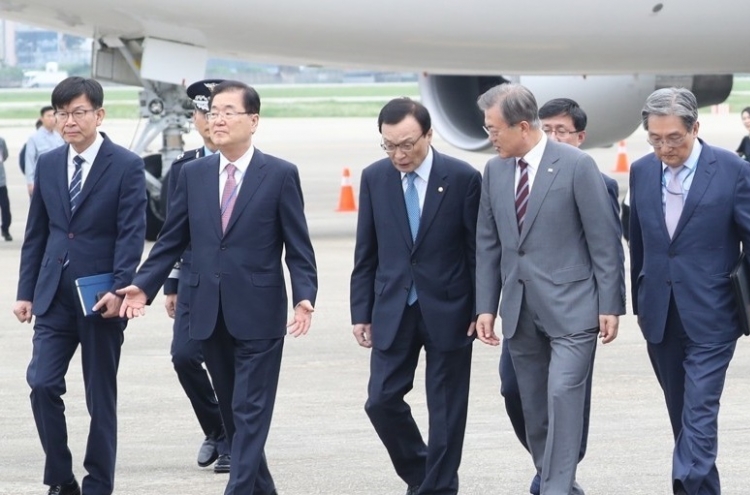 Moon back in Seoul amid political trouble over justice minister pick
