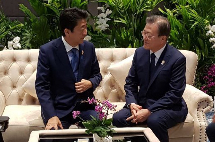 Moon, Abe agree to seek resolution to trade issues