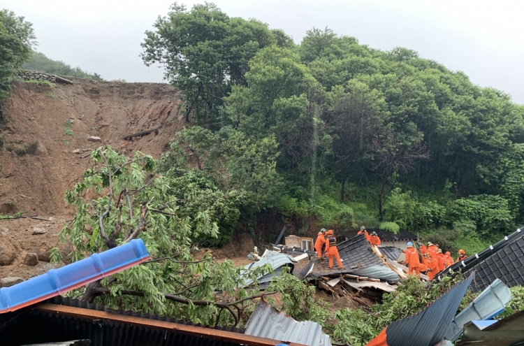 Downpours trigger landslide, cut off power, leave 2 dead in southern parts of Korea