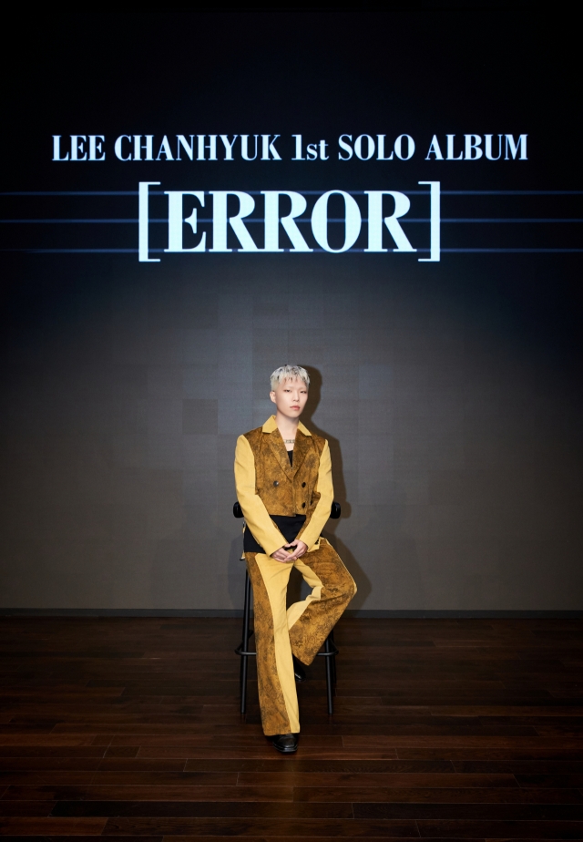 Lee Chan-hyuk poses during a press conference for his first solo album, “Error,” at YG Entertainment in Mapo-gu, western Seoul, on Monday. (YG Entertainment)