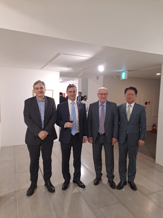 Hungarian Ambassador to Korea Istvan Szerdahelyi( second from left) poses for a photo with guests during a reception hosted as part of the