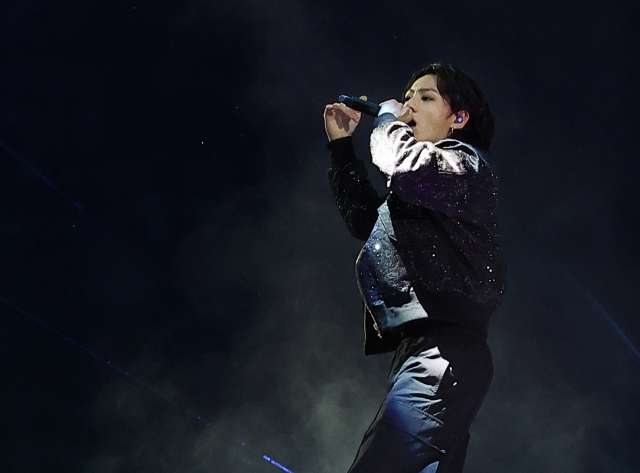 BTS member Jungkook performs during the opening ceremony for the 2022 FIFA World Cup at Al Bayt Stadium in Al Khor, north of Doha, last Sunday. (Yonhap)