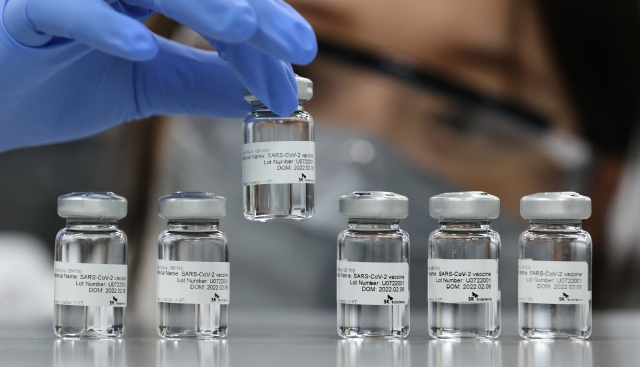 A SK Bioscience researcher checks SKYCovione, the nation's first homegrown COVID-19 vaccine, at the company's research lab. (SK Bioscience)