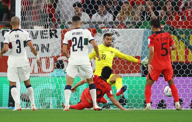 South Korea's Kim Young-gwon scores their first goal during the FIFA World Cup 2022 group H soccer match between South Korea and Portugal at Education City Stadium in Doha, Qatar, Friday. (AFP)