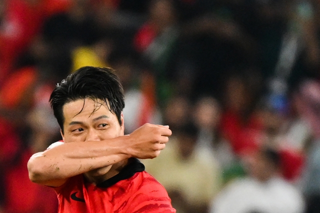 South Korea's defender #19 Kim Young-gwon celebrates scoring his team's first goal during the Qatar 2022 World Cup Group H football match between South Korea and Portugal at the Education City Stadium in Al-Rayyan, west of Doha on Friday. (AFP)