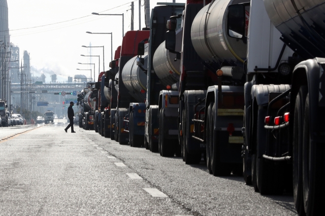 Petrochemical tanker trucks sit idle in Yeosu, South Jeolla Province, on Thursday. (Yonhap)